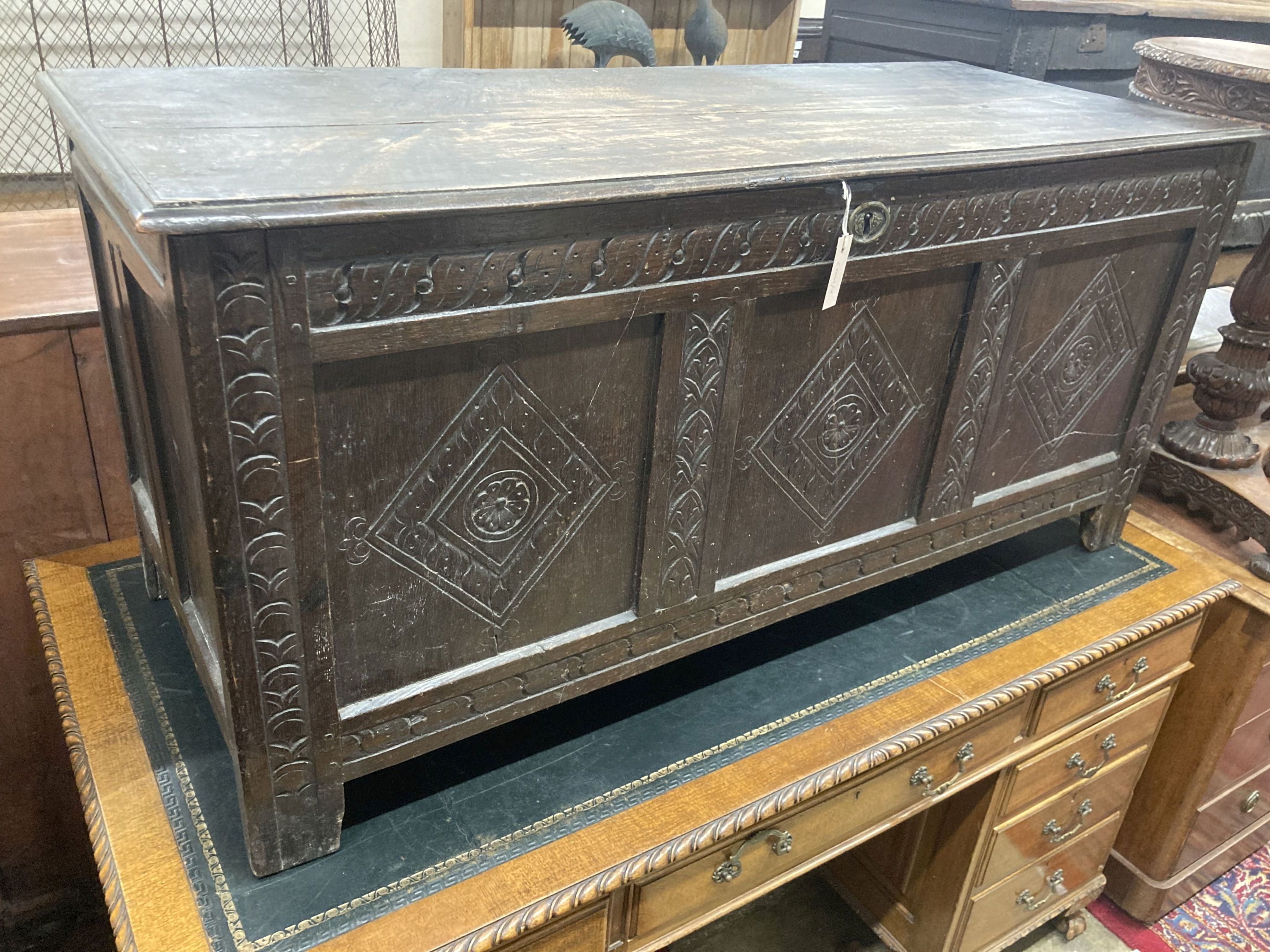 An early 18th century panelled oak coffer, length 134cm, depth 54cm, height 63cm